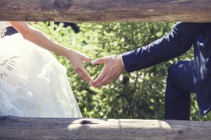 Man and woman couple holding hands on a romantic date or a wedding